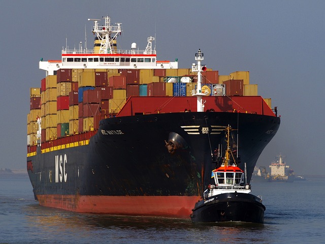 A cargo ship loaded with shipping containers, used as a metaphor for the slow throughput of traditional disk-based storage