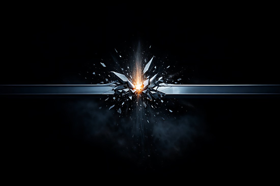 A steel beam breached by an upward force, fragments suspended mid-burst against a near-black background, with an amber ignition point at the point of rupture